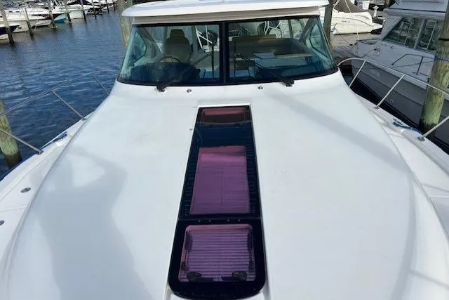 Slide: The Image of 2014 Tiara Yachts 3900 Coronet docked at marina, front deck view. - 10