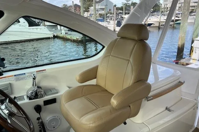 Slide: The Image of Captain's seat on 2014 Tiara Yachts 3900 Coronet, overlooking marina. - 14