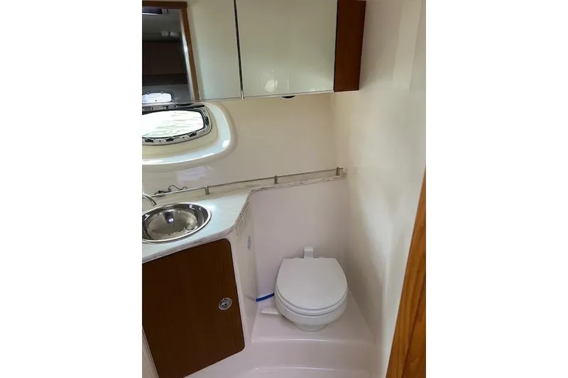 Slide: The Image of 2014 Tiara Yachts 3900 Coronet bathroom with sink, toilet, and mirror. - 23