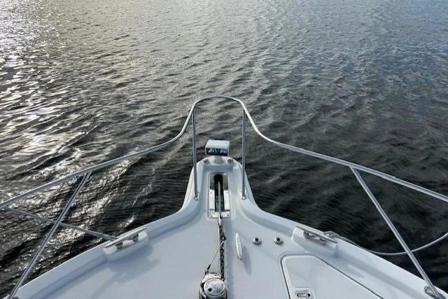 Slide: The Image of Bow view of 2014 Tiara Yachts 3900 Coronet on calm water. - 8