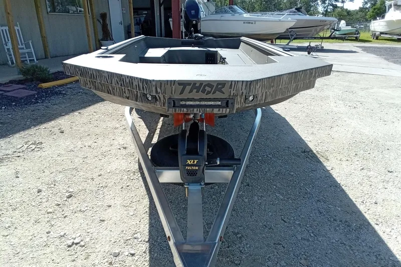 Slide: The Image of 2026 Thor 1754 Timber Hammer boat on trailer, outdoor display. - 4