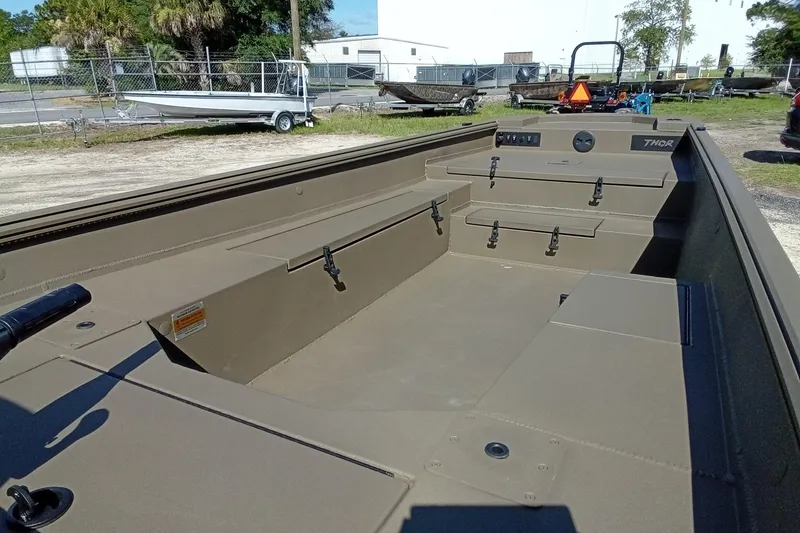 Slide: The Image of 2026 Thor 1754 Timber Hammer boat interior, featuring spacious seating and storage compartments. - 9