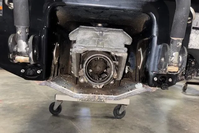 Slide: The Image of 2005 Sea-Doo Wake 155 jet ski engine compartment on display in a garage setting. - 10