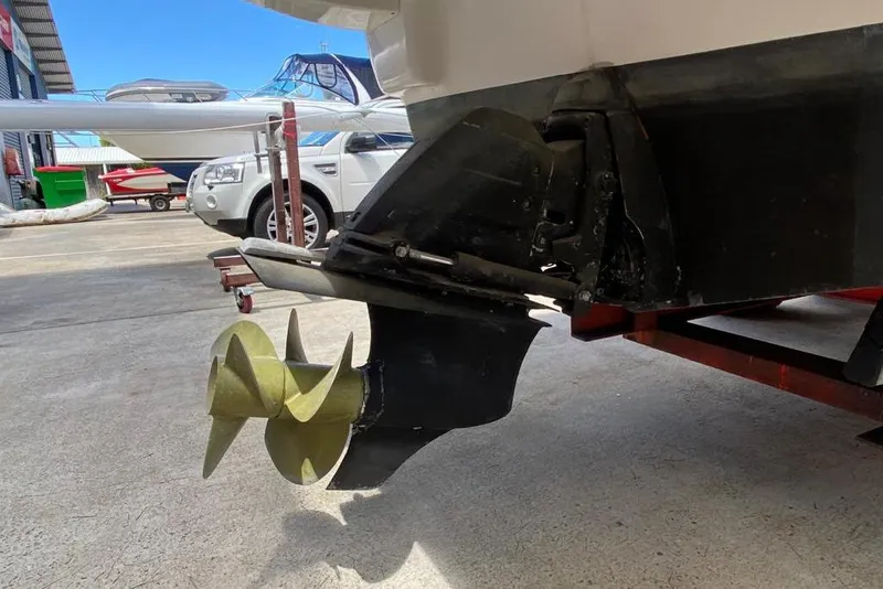 Slide: The Image of Close-up of Jeanneau Leader 805's propeller and stern, 2008 model, in a boatyard setting. - 10