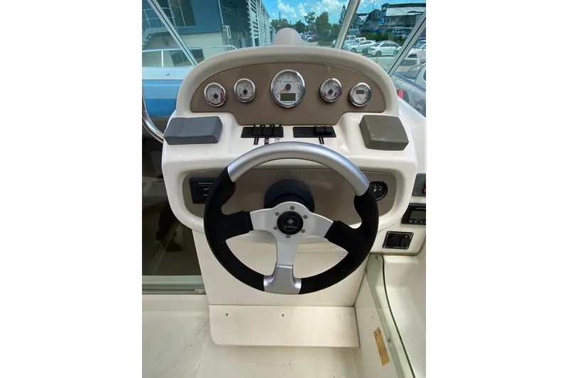 Slide: The Image of Steering wheel and dashboard of 2008 Jeanneau Leader 805 boat. - 8