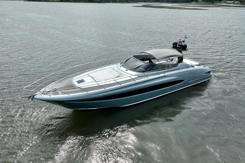 Slide: The Image of Luxurious 2016 Riva 63 Virtus yacht cruising on calm waters, showcasing sleek design and elegance. - 10