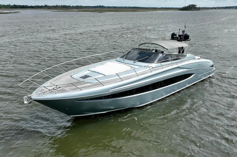 Slide: The Image of 2016 Riva 63 Virtus luxury yacht cruising on open water. - 12