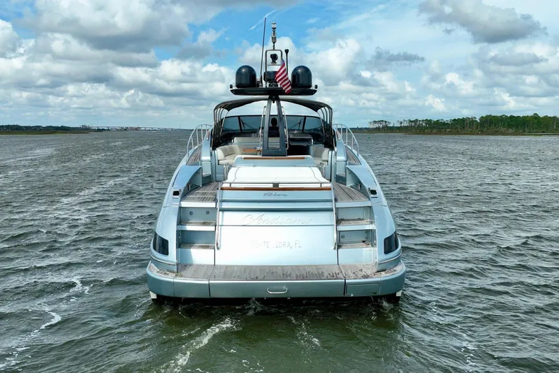 Slide: The Image of 2016 Riva 63 Virtus yacht on open water under a cloudy sky. - 13