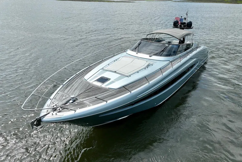 Slide: The Image of 2016 Riva 63 Virtus luxury yacht cruising on open water. - 2