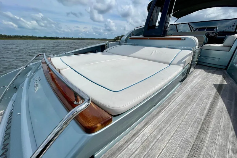 Slide: The Image of Luxurious 2016 Riva 63 Virtus yacht with spacious sunbathing deck on open water. - 26