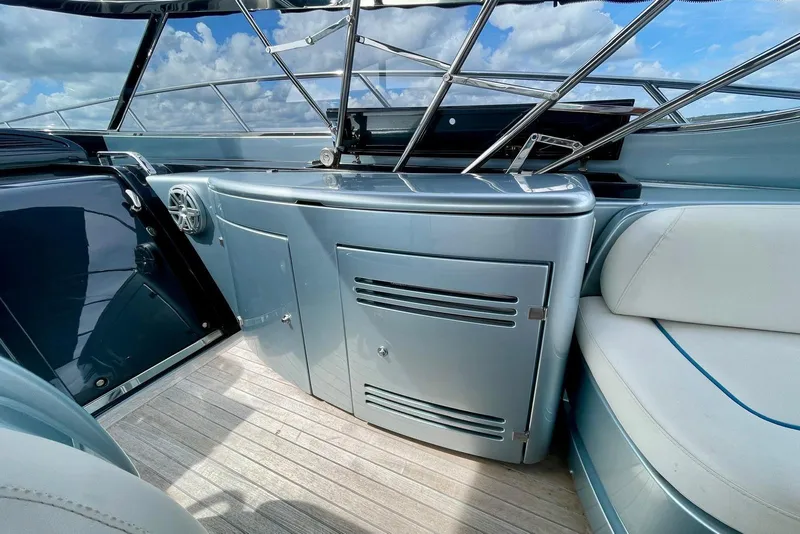 Slide: The Image of 2016 Riva 63 Virtus yacht interior with sleek cabinetry and luxurious seating. - 28