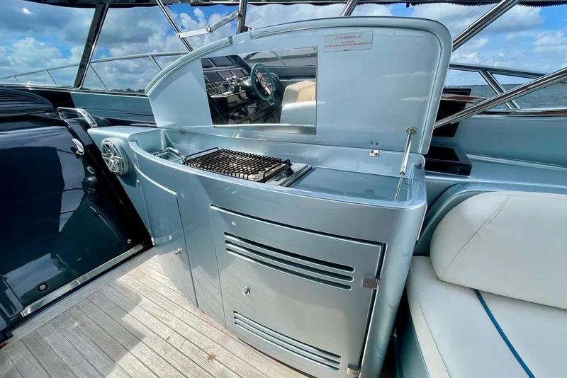 Slide: The Image of Luxury outdoor kitchen on 2016 Riva 63 Virtus yacht with grill and seating. - 29