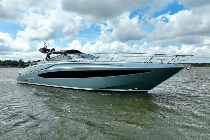 Slide: The Image of 2016 Riva 63 Virtus yacht cruising on a calm, cloudy day. - 3