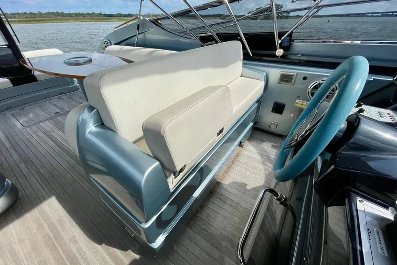 Slide: The Image of Interior of 2016 Riva 63 Virtus yacht with steering wheel and seating area. - 32