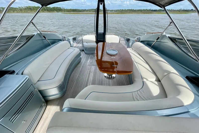Slide: The Image of Luxurious 2016 Riva 63 Virtus yacht interior with elegant seating and wooden table. - 33