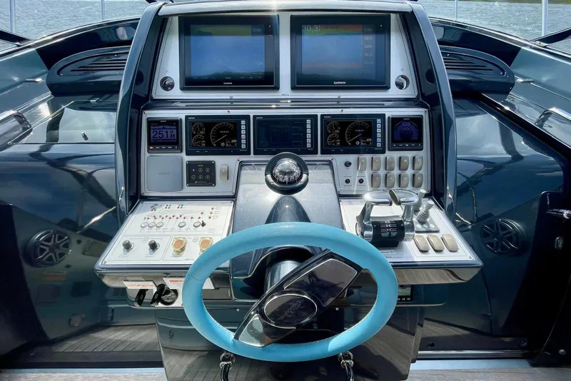 Slide: The Image of Cockpit of 2016 Riva 63 Virtus yacht with advanced navigation controls and displays. - 36