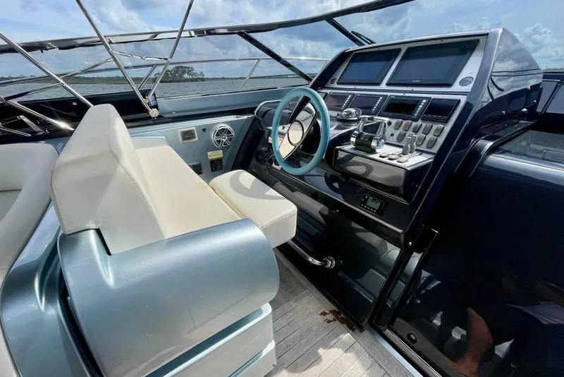 Slide: The Image of 2016 Riva 63 Virtus yacht cockpit with modern controls and luxurious seating. - 37