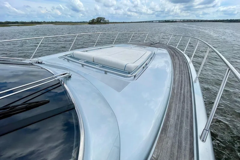 Slide: The Image of 2016 Riva 63 Virtus yacht deck with sleek design on open water. - 38