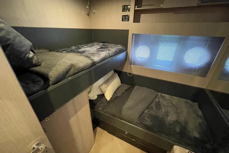 Slide: The Image of Luxurious cabin interior of 2016 Riva 63 Virtus yacht with cozy bunk beds. - 47