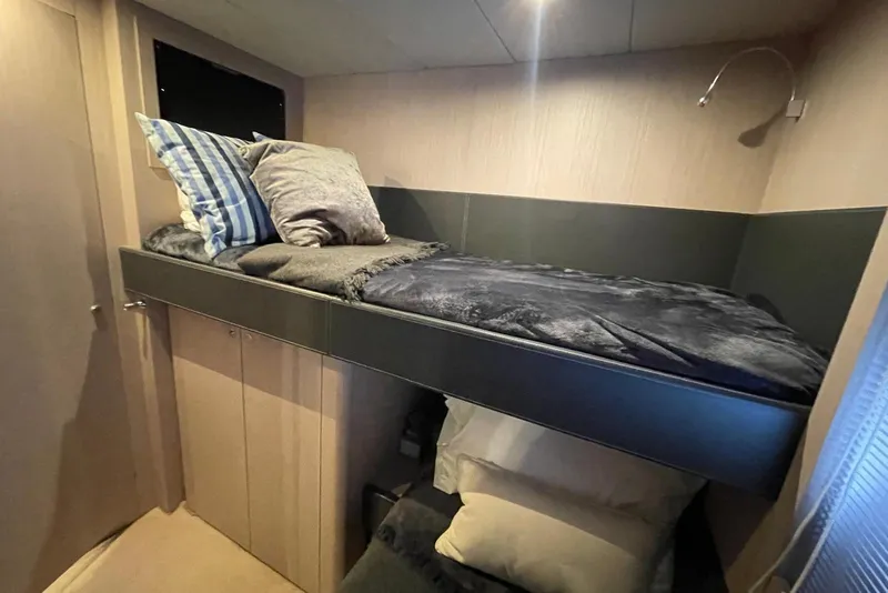 Slide: The Image of Cozy cabin interior of 2016 Riva 63 Virtus yacht with bunk bed and pillows. - 48