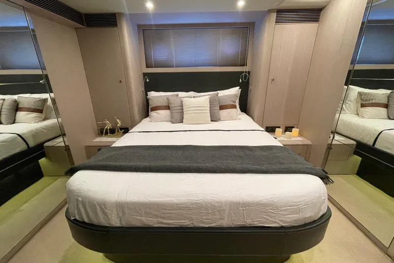 Slide: The Image of Luxurious bedroom interior on 2016 Riva 63 Virtus yacht, featuring elegant bedding and ambient lighting. - 50