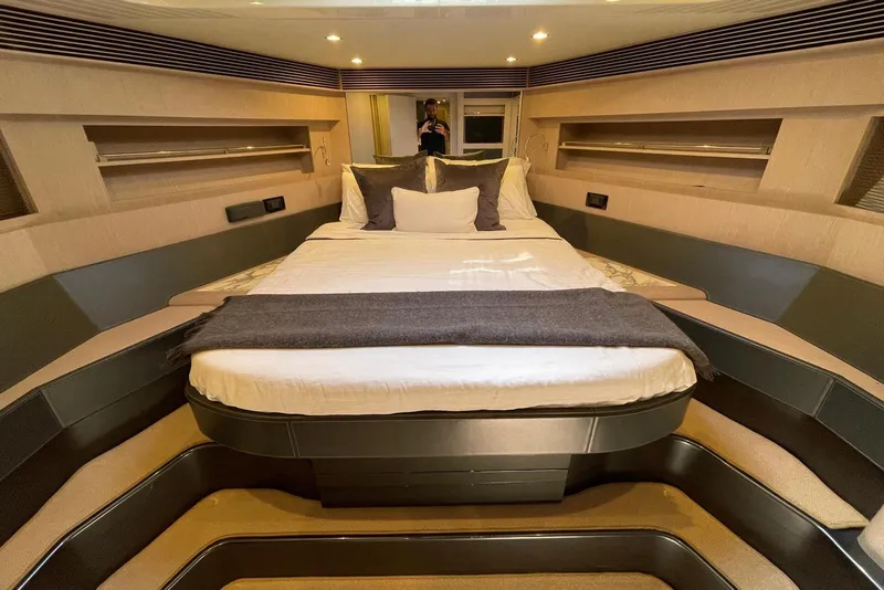 Slide: The Image of Luxurious bedroom interior of 2016 Riva 63 Virtus yacht with elegant bedding and ambient lighting. - 54