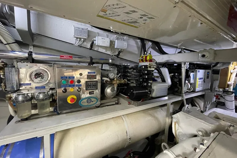 Slide: The Image of Engine room of 2016 Riva 63 Virtus yacht with control panels and machinery. - 57