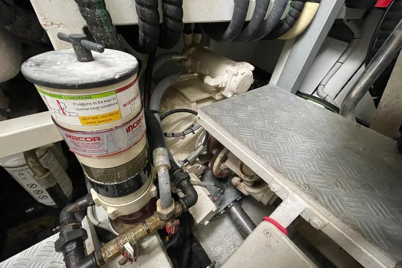 Slide: The Image of Engine room of 2016 Riva 63 Virtus yacht, showcasing mechanical components and piping. - 60