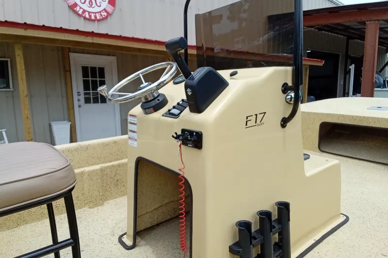 Slide: The Image of Fibercraft F17 Skiff 2025 boat console with steering wheel and controls. - 11