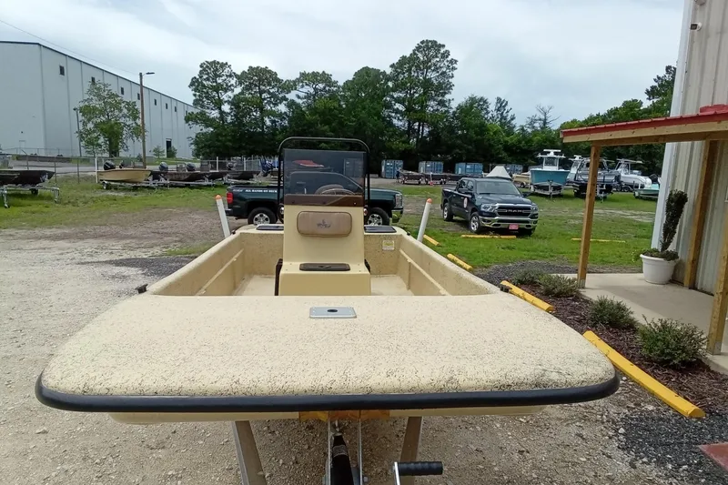 Slide: The Image of 2025 Fibercraft F17 boat on trailer in outdoor storage area. - 17