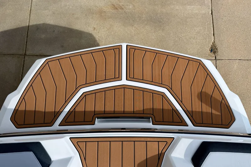 Slide: The Image of 2026 Nautique Super Air Nautique GS20 swim platform with teak-style decking. - 11