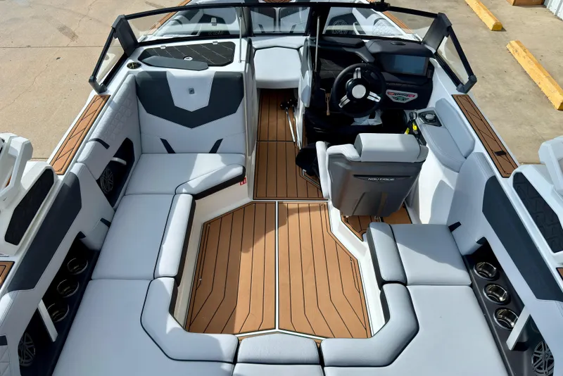 Slide: The Image of 2026 Nautique Super Air Nautique GS20 interior with sleek seating and modern dashboard design. - 13
