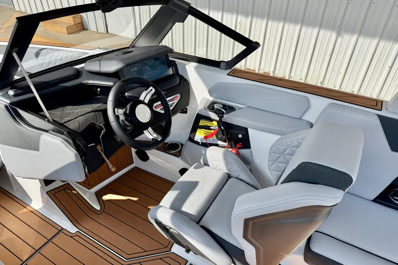 Slide: The Image of 2026 Nautique Super Air Nautique GS20 interior with modern dashboard and seating. - 14