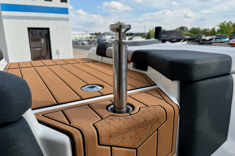 Slide: The Image of 2026 Nautique Super Air Nautique GS20 boat deck with teak finish and stainless steel features. - 35