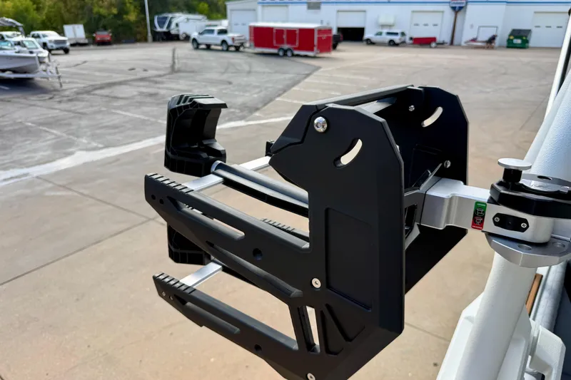 Slide: The Image of Wakeboard rack on 2026 Nautique Super Air Nautique GS20, parked in a marina. - 36