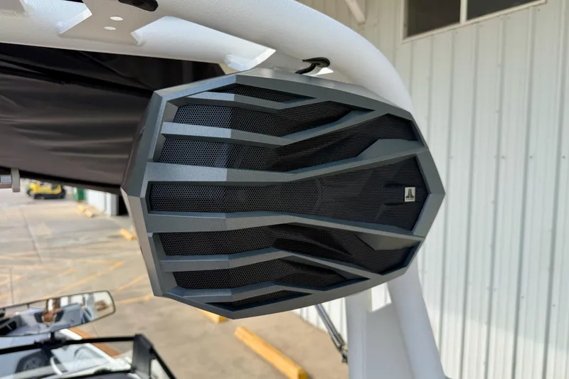 Slide: The Image of Close-up of a speaker on a 2026 Nautique Super Air Nautique GS20 boat. - 38