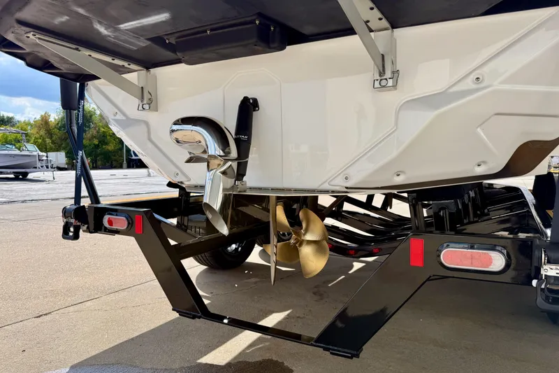 Slide: The Image of 2026 Nautique Super Air Nautique GS20 boat on trailer, showcasing propeller and hull design. - 6