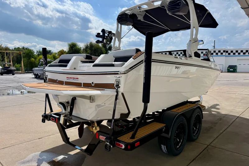 Slide: The Image of 2026 Nautique Super Air Nautique GS20 boat on trailer, sunny day, outdoor setting. - 8