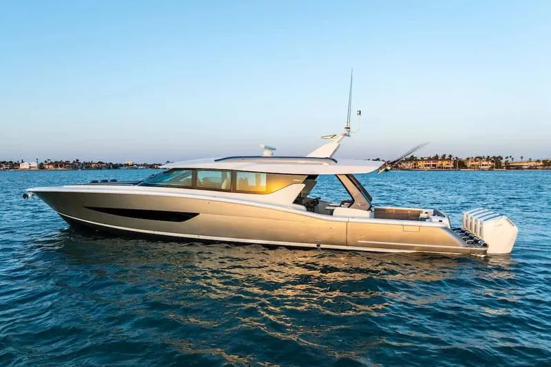 Slide: The Image of Manufacturer Provided Image: 2026 Scout 670 LXS luxury yacht cruising on calm blue waters at sunset. - 1