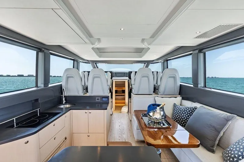Slide: The Image of Manufacturer Provided Image: Luxurious interior of 2026 Scout 670 LXS yacht with modern kitchen and seating area. - 10