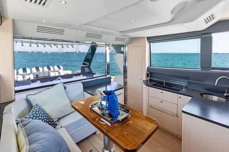 Slide: The Image of Manufacturer Provided Image: Luxurious interior of 2026 Scout 670 LXS yacht with ocean view and modern amenities. - 13