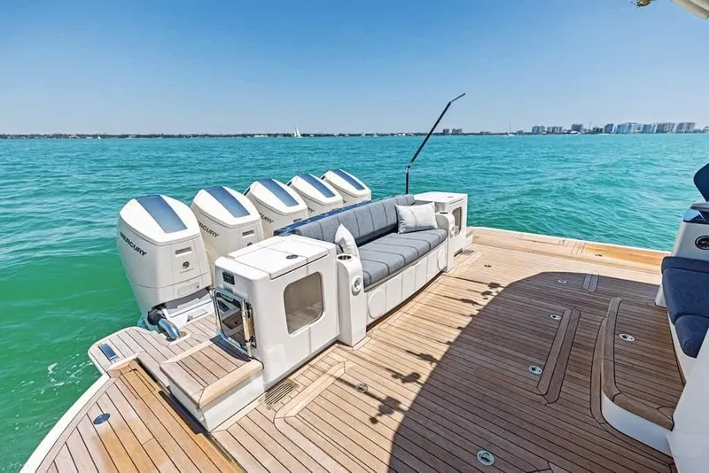 Slide: The Image of Manufacturer Provided Image: Luxurious 2026 Scout 670 LXS boat with spacious deck and powerful engines on open water. - 15