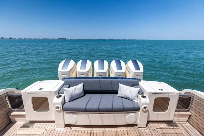 Slide: The Image of Manufacturer Provided Image: Luxury 2026 Scout 670 LXS boat with spacious seating and powerful engines on open water. - 16