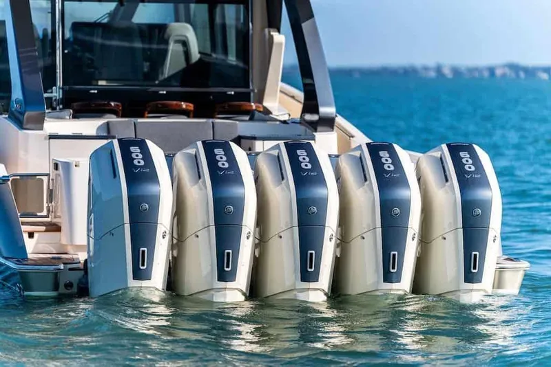 Slide: The Image of Manufacturer Provided Image: 2026 Scout 670 LXS boat with five powerful outboard engines on the water. - 17