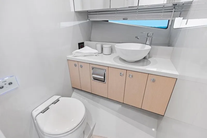 Slide: The Image of Manufacturer Provided Image: Luxurious bathroom in 2026 Scout 670 LXS yacht with modern fixtures and sleek design. - 22