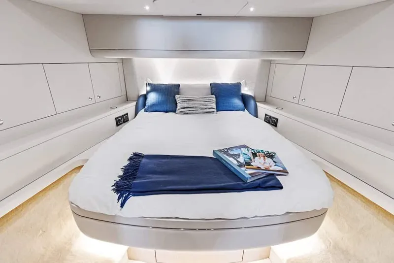 Slide: The Image of Manufacturer Provided Image: Luxurious cabin interior of 2026 Scout 670 LXS yacht with cozy bedding and elegant decor. - 25