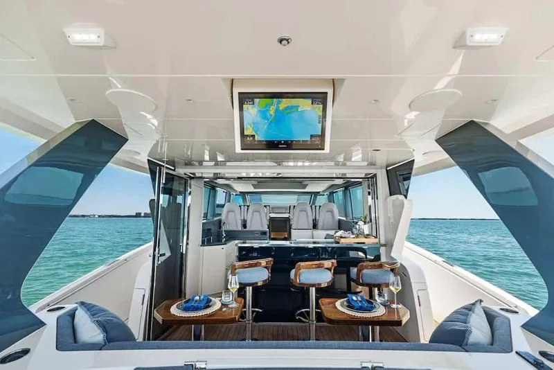 Slide: The Image of Manufacturer Provided Image: Luxurious interior of 2026 Scout 670 LXS yacht with elegant seating and ocean view. - 9