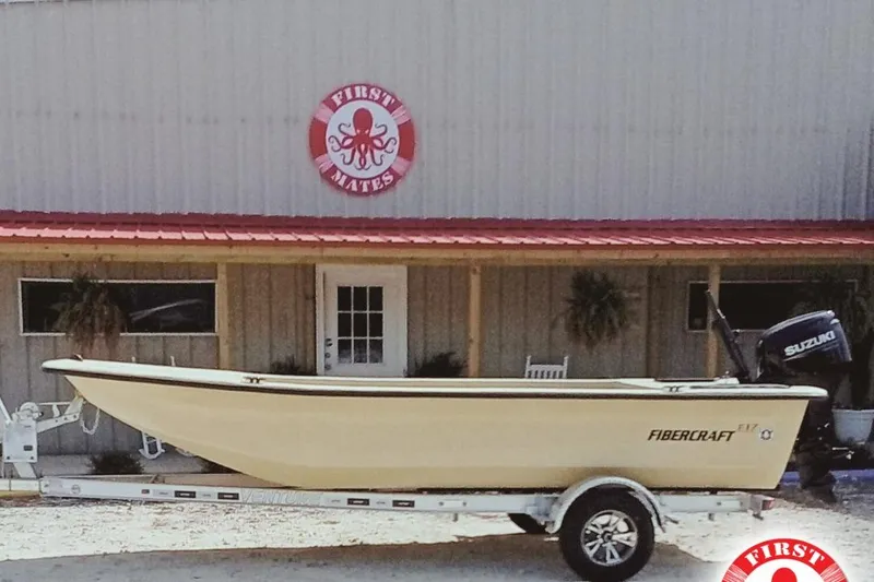 The Image of Fibercraft F17 boat on trailer outside First Mates building, 2025 model. - 1