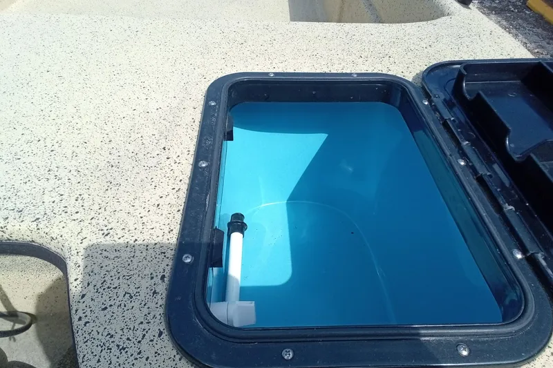 Slide: The Image of Open hatch on Fibercraft F17 boat, 2025 model, showing interior compartment. - 11