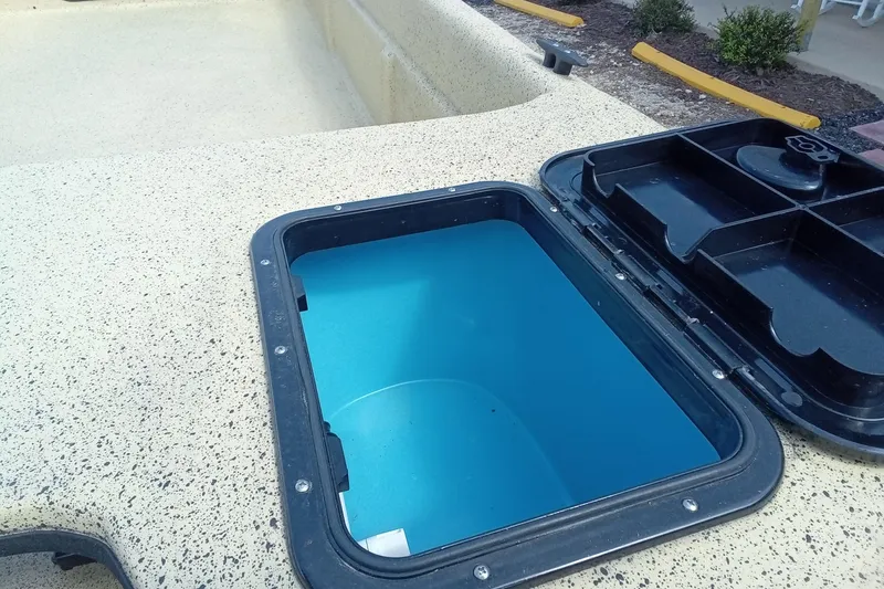 Slide: The Image of Open storage compartment on 2025 Fibercraft F17 boat, showcasing interior design. - 9